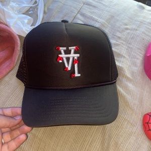 Brown La hat with red hearts